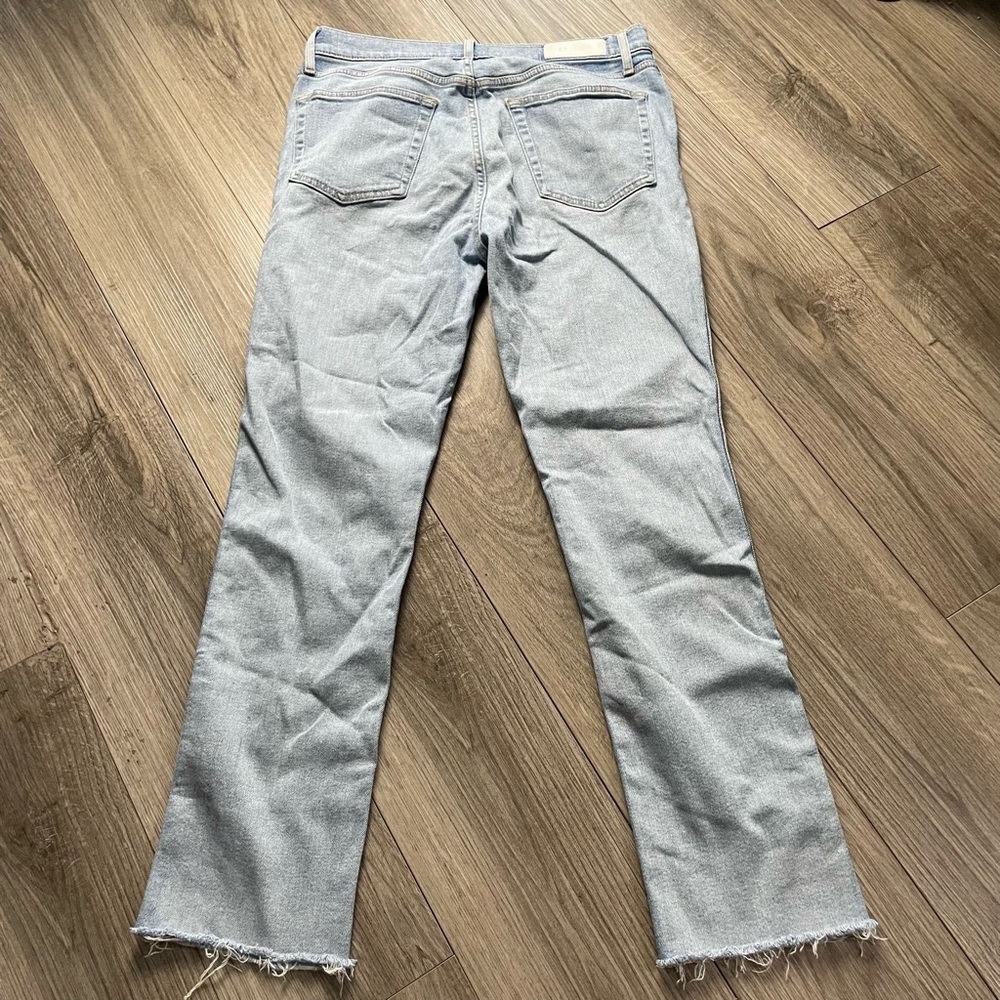 RE/DONE Light washed jeans with frayed bottom